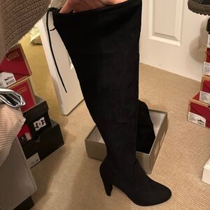 Thigh high heeled boots